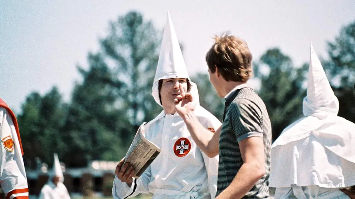 Bruce Larsen confronting a Ku Klux Klan member in Auburn, Alabama (1986)
