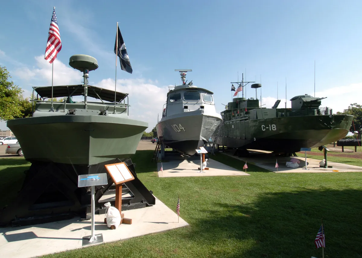 US Navy 041111-N-7949W-007 Visitors to the Vietnam Unit Memorial Monument, on board Naval Amphibious Base Coronado, Calif., have a chance to look at patrol craft and coastal patrol boats on display, California