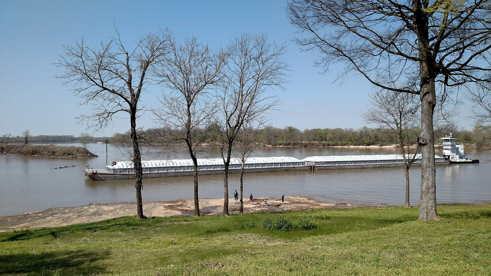 A barge on the Arkansas River at Fort Smith National Historic Site in Fort Smith, Arkansas (08e3b1f0-b5a7-406e-a592-70ebab037980)