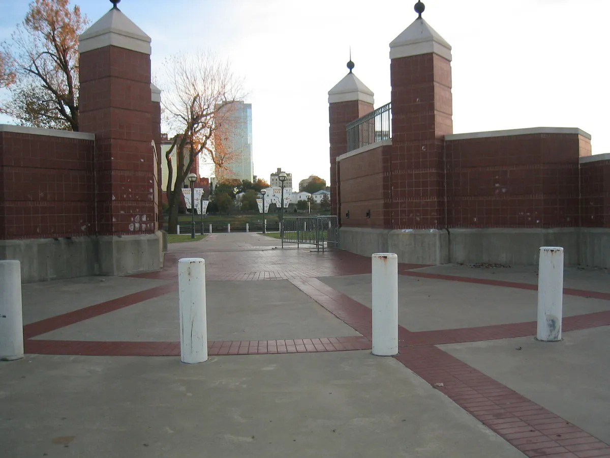 A brick park walking path leads to the Arkansas River in North Little Rock, Arkansas (fd1d11c5-f57a-406b-ab4f-d7d2f80a68ea)
