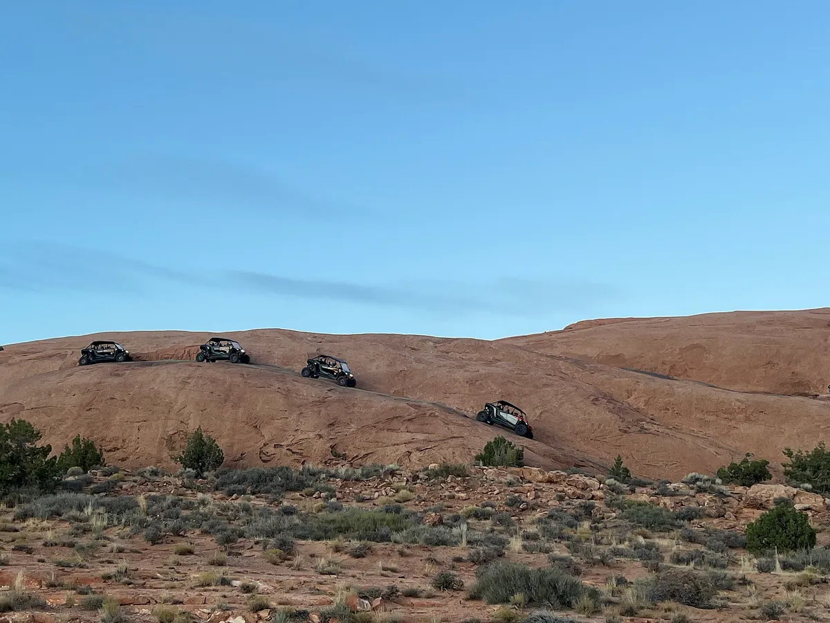 Sand Flats OHVs down a hill (54283798945) in Moab, Utah