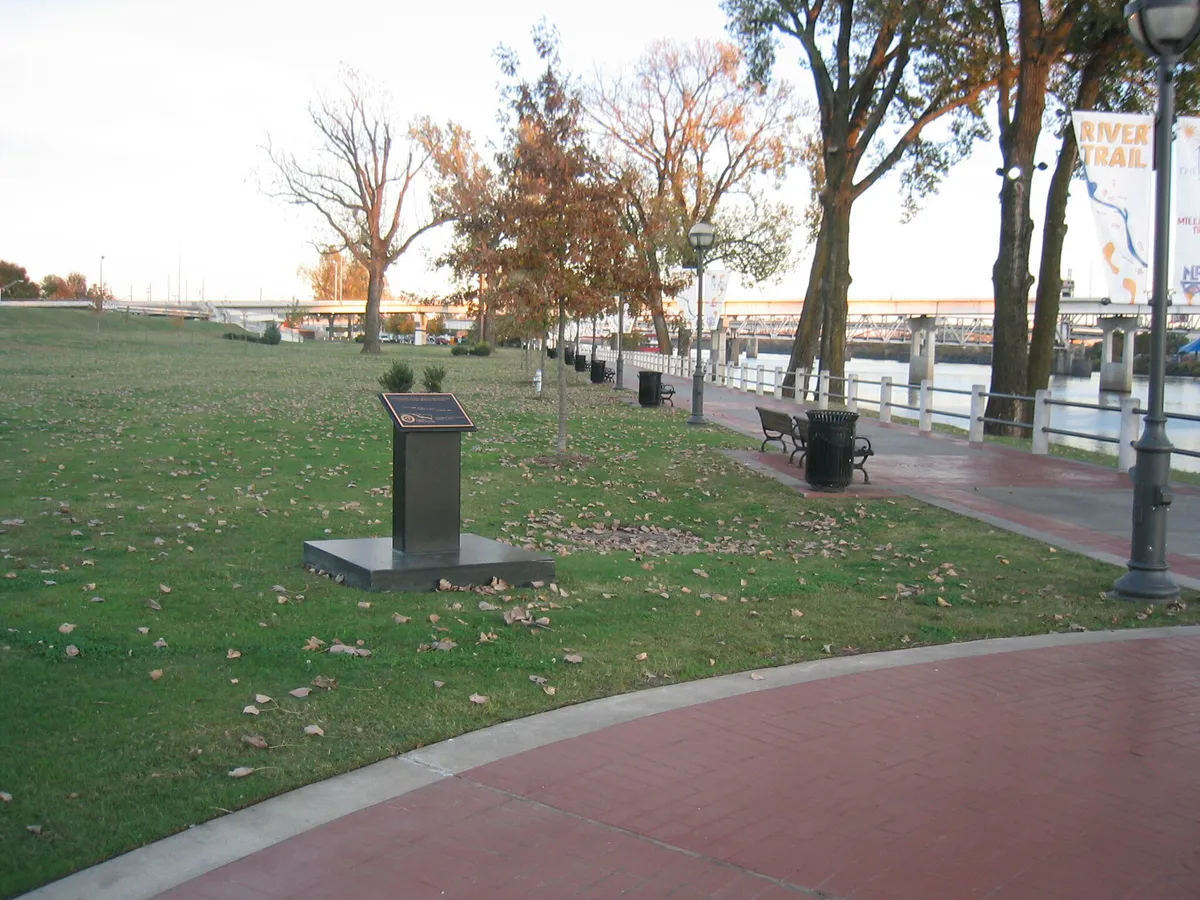 A marker on a recreational trail along the Arkansas River in North Little Rock, Arkansas (f675a557-9be7-4511-a1f2-40aaaaf2ecec)