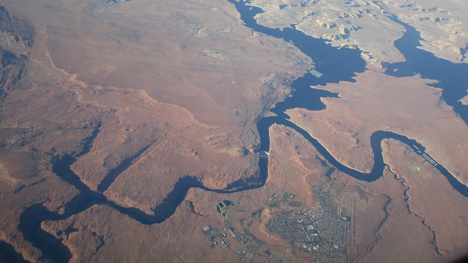 Arizona & Utah - Lake Powell aerial view of Glen Canyon Dam (in the center of pic), Wahweap Marina (center top), the town of Page (center down) and on the left Colorado River downstream towards Grand Canyon (50294961102)