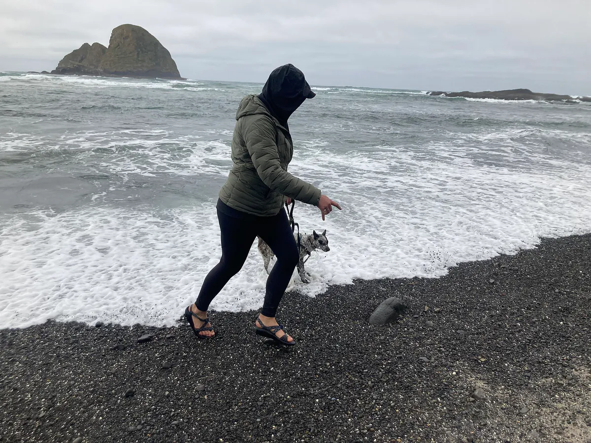 Woman and dog at Tunnel Beach in Seaside Oregon